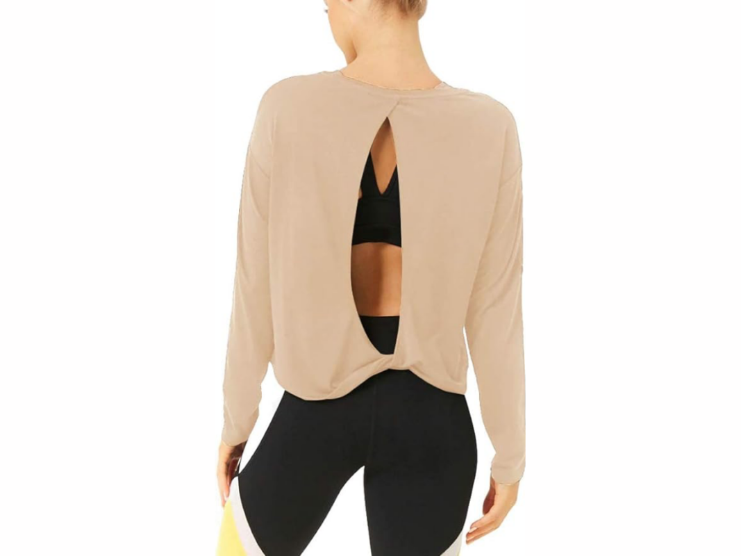 This image features a woman's back wearing an open-back top with long sleeves in the color tan.
