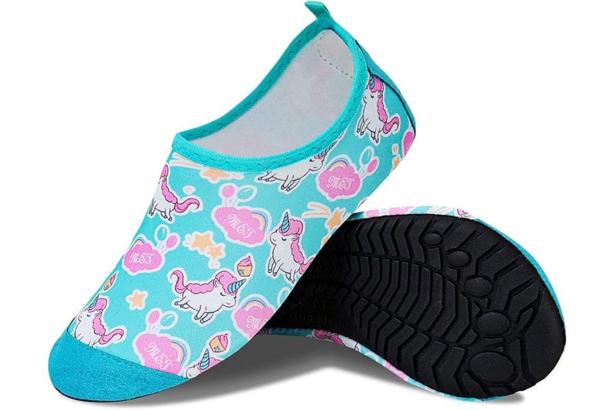 A pair of water shoes for toddlers with a blue and pink unicorn design. The shoes have a turquoise trim and a pull tab at the back. One shoe is shown upright, while the other is propped up to display the black sole with a rugged tread pattern.