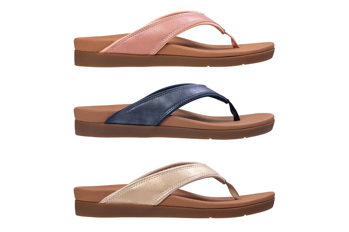 A flip flop with a tan foot bed and pink strap, over a A flip flop with a tan foot bed and blue strap, over A flip flop with a tan foot bed and gold strap.