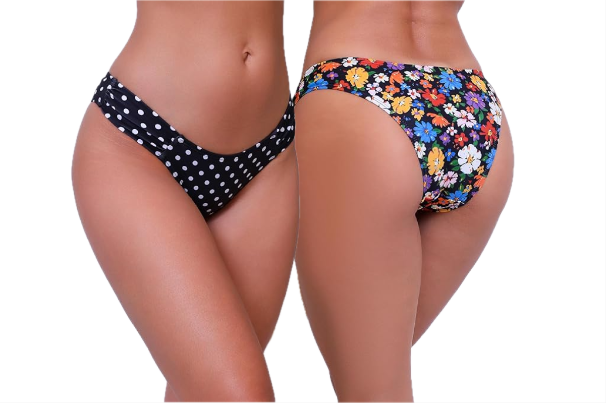 Two women wearing bikini bottoms. The one on the left is wearing a black bikini bottom with white polka dots. The one on the right is wearing a floral bikini bottom.