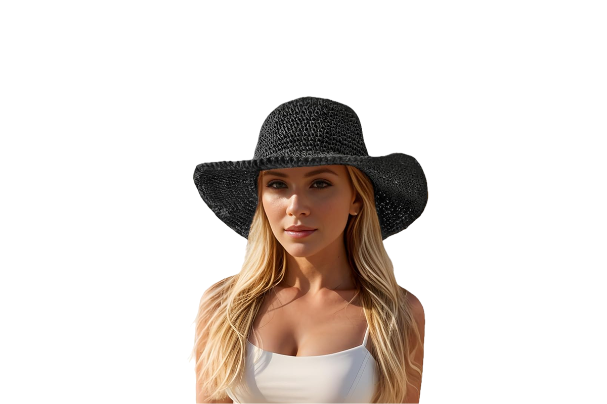 A woman with blond hair wearing a black straw floppy hat.