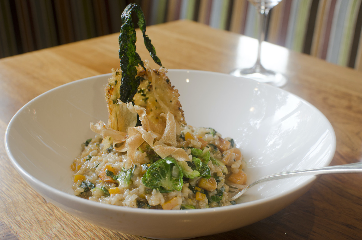 Brown rice risotto with butternut squash, brussel sprout leaves, Bloomsdale spinach, persimmon and sage.