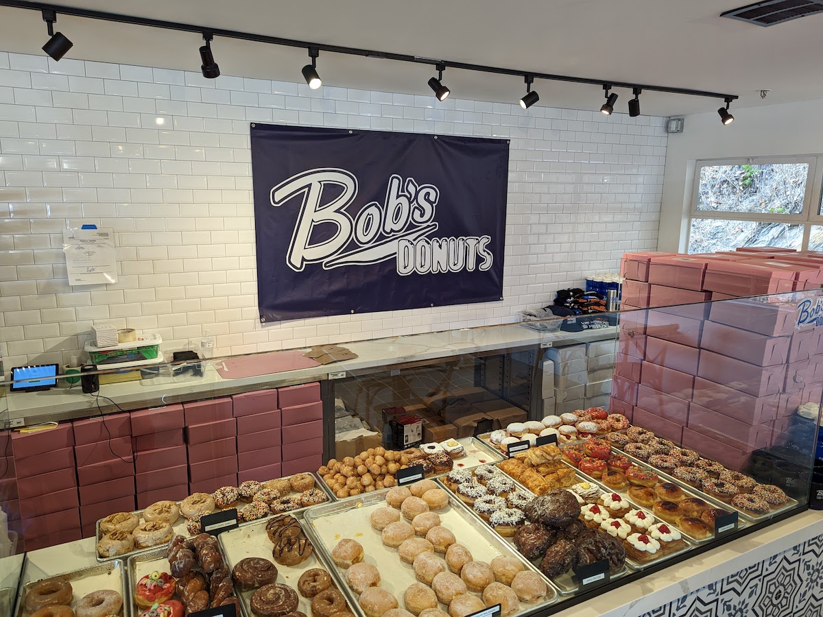 Interior of Bob's Donuts Mill Valley with case full of colorful donuts