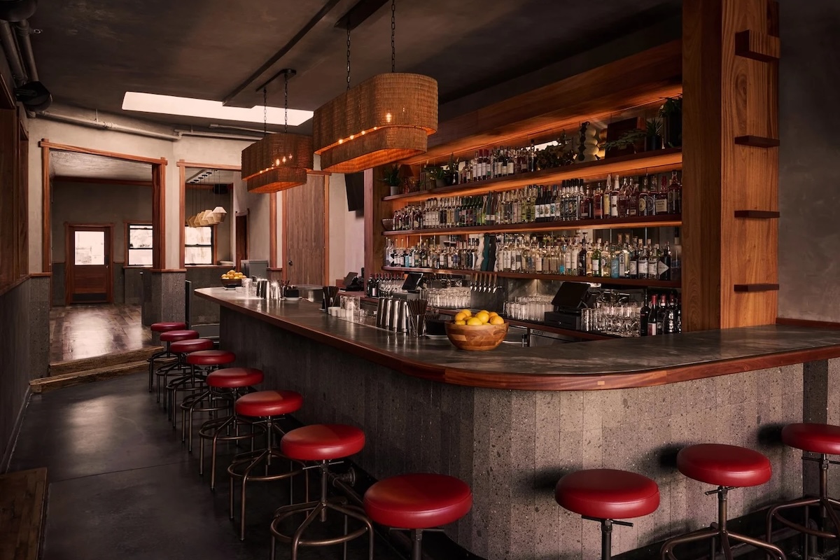 A bar with ambient lighting and red accents.