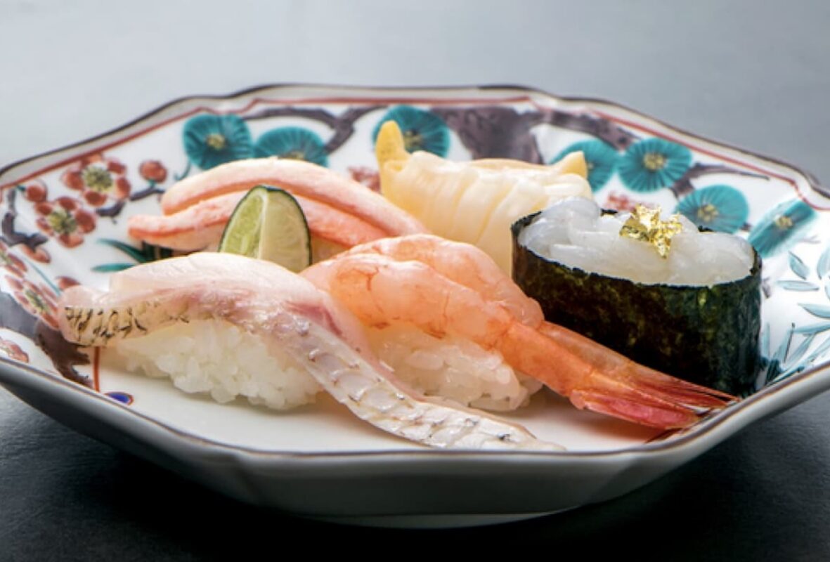 A plate with various pieces of sushi.