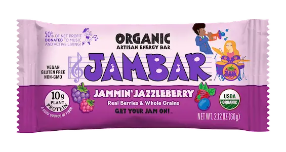 Image of a JAMBAR energy bar package in the "Jammin' Jazzyberry" flavor. The packaging features vibrant graphics including berries, whole grains, musical notes, and characters playing instruments. The label highlights that it is organic, vegan, gluten-free, and non-GMO.