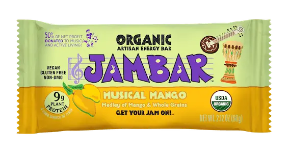 Packaging of an energy bar labeled "Musical Mango" by JAMBAR. The design highlights "9g plant protein," "vegan," "gluten-free," "non-GMO," and "USDA Organic." Notably, 50% of net profit is donated to music and active living.