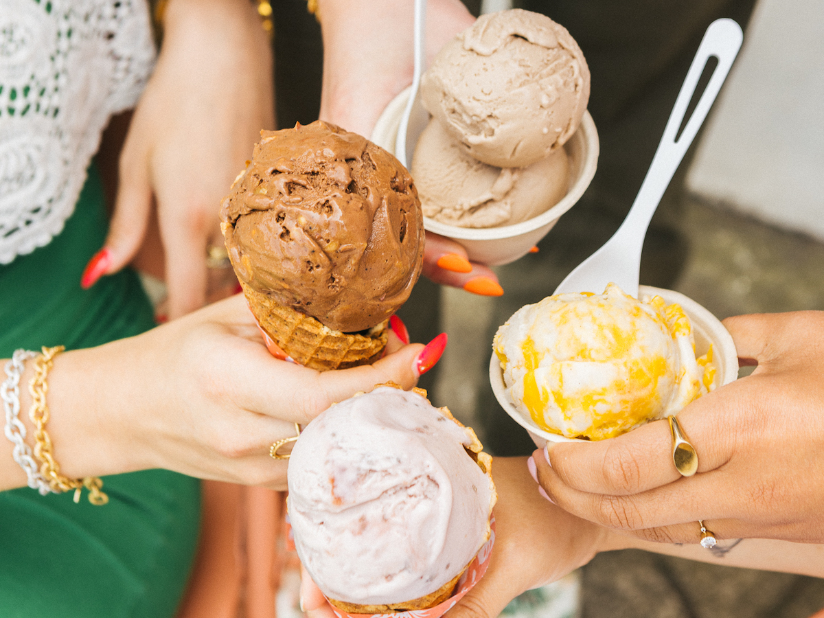 Friends hold four different ice cream scoops from Frankie and Jo's in Larkspur