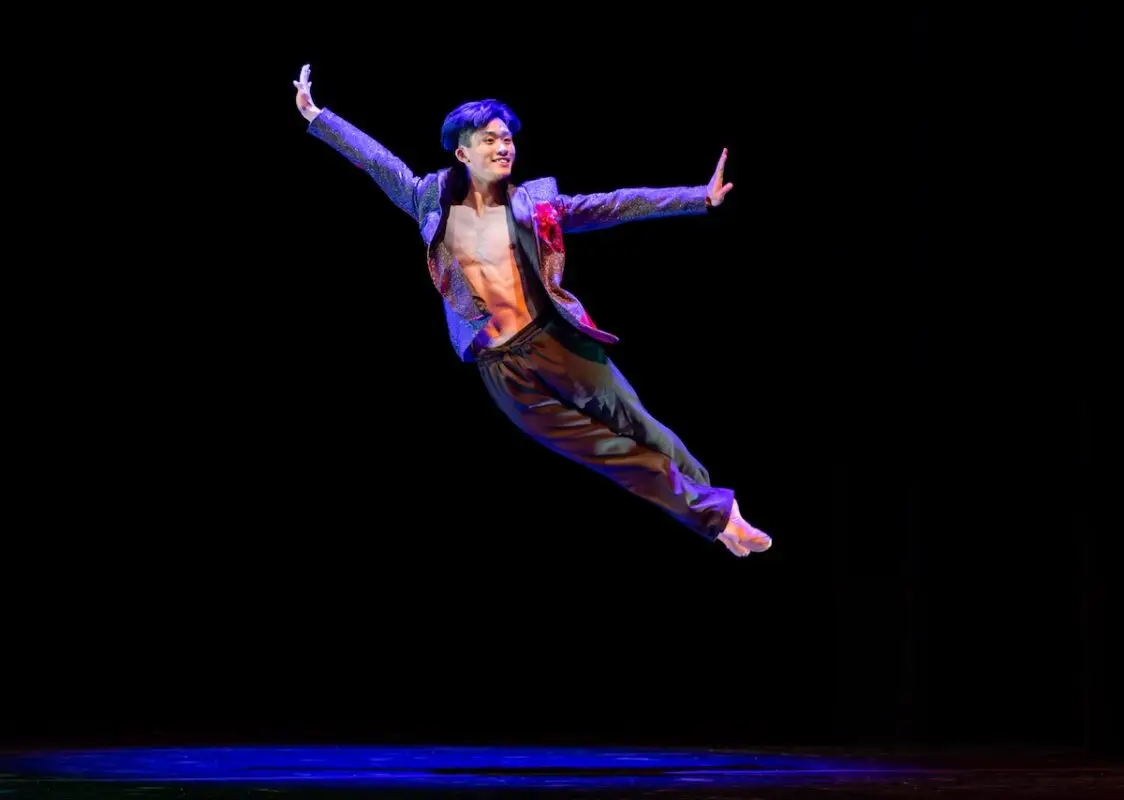 Dancer Lawrence Chen in mid-air performing Rainbow Dances for the Oakland Ballet's Dancing Moons Festival in April in Oakland and San Francisco, California
