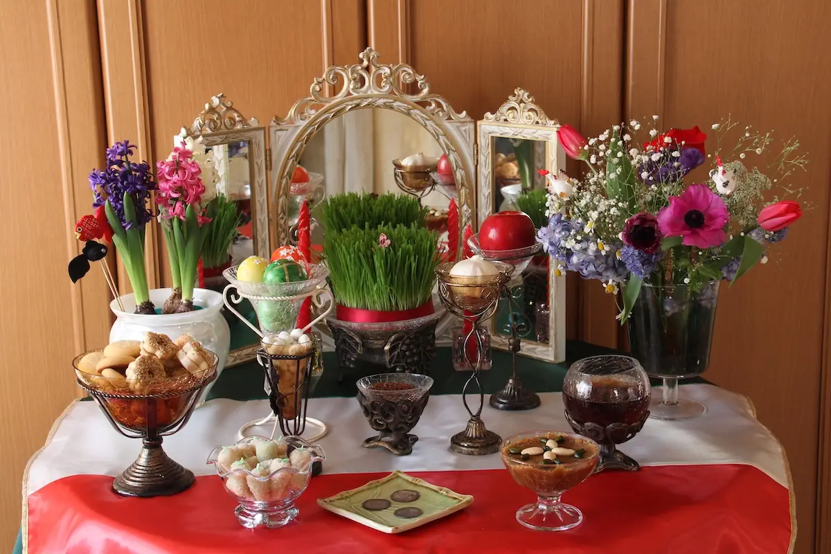 Table arrangement with flowers, eggs, a mirror and more for Persian New Year (Nowruz), celebrated in Marin in San Rafael, California