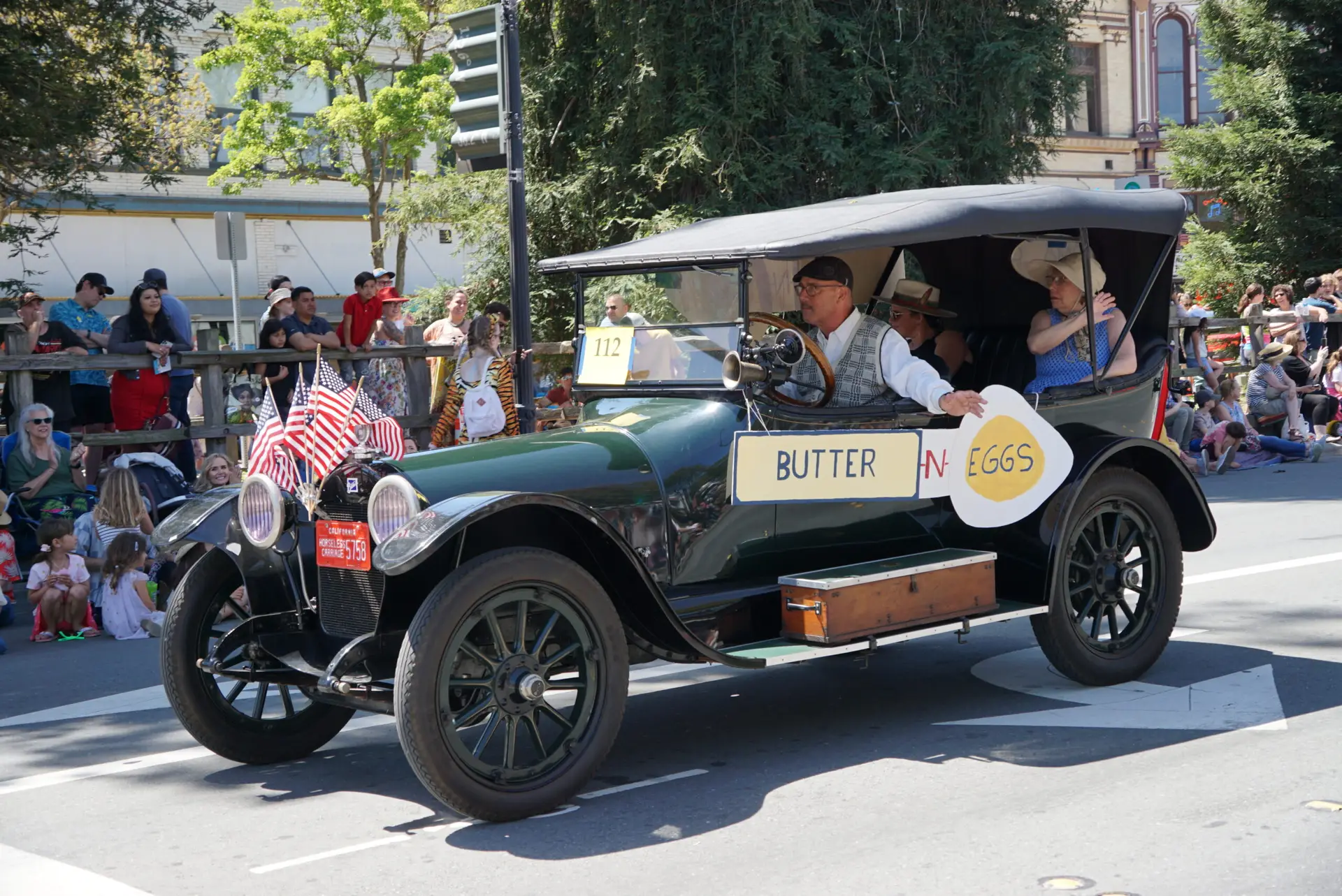 Old car with sign saying "Butter 'n Eggs" at the Butter and Eggs Day Parade, every April in the North Bay's Petaluma, California