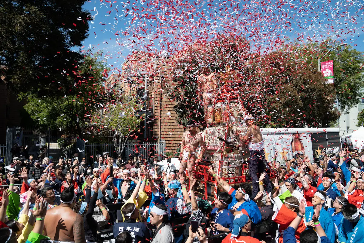 Confetti explodes over parade float at Japantown's Japanese Cherry Blossom Festival in San Francisco, California