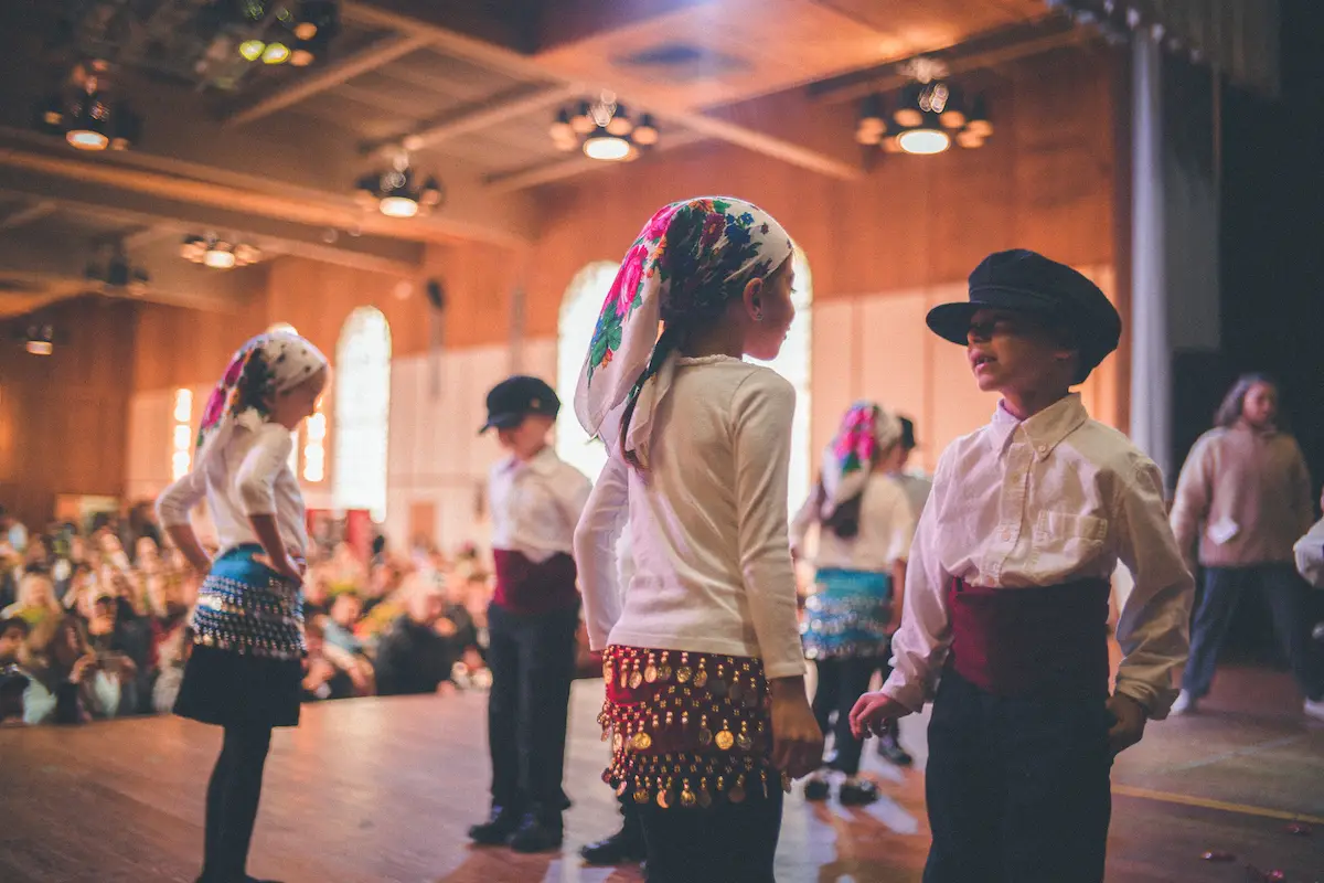 Children dance in traditional costume at the Greek festival in Oakland, California.