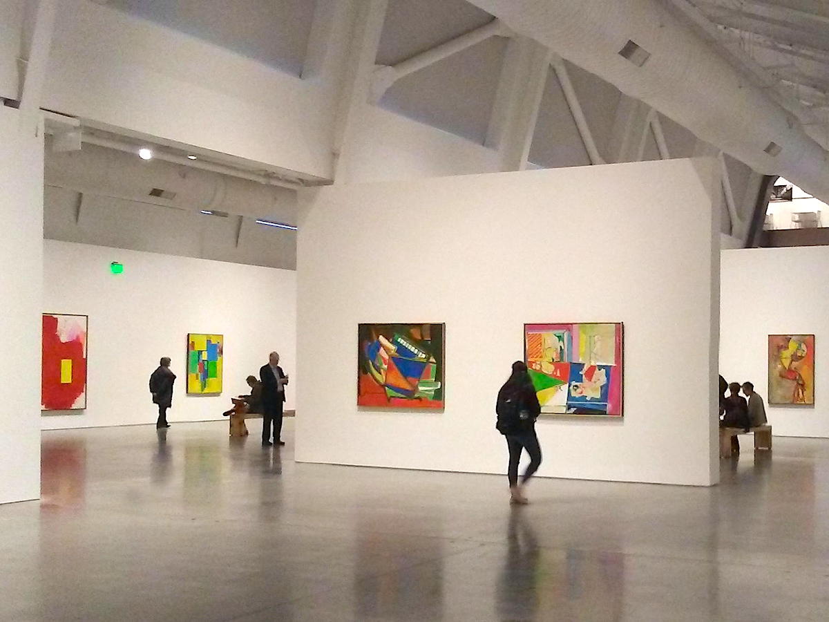 Museum goers browse paintings at Berkeley art museum