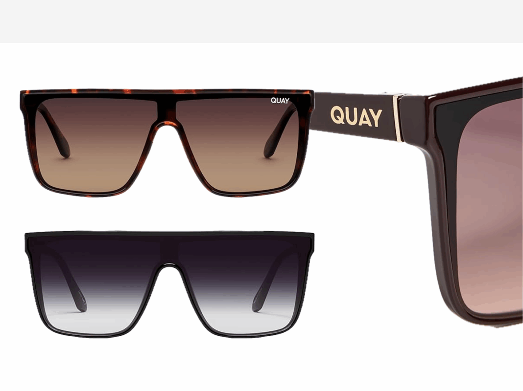 A pair of oversized sunglasses in black and tan.