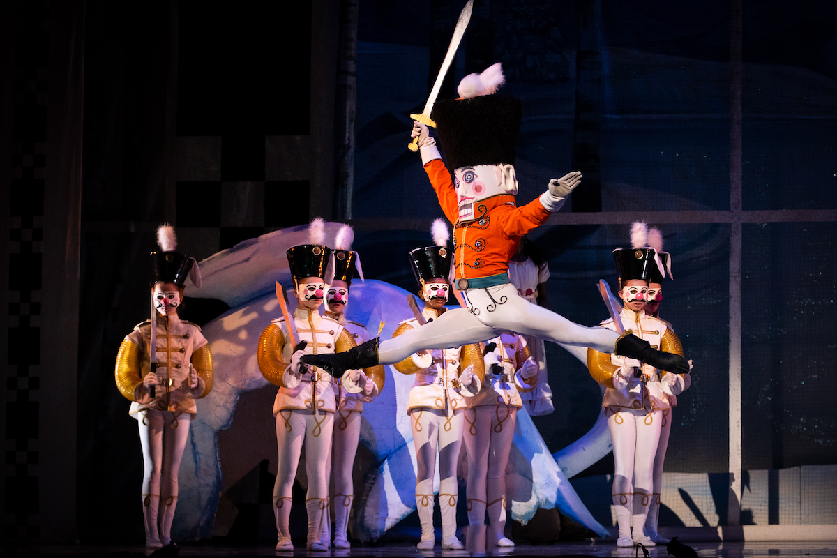 Ballet dancers at Oakland Ballet in costume for the Nutcracker, with a central dancer dressed as the nutcracker