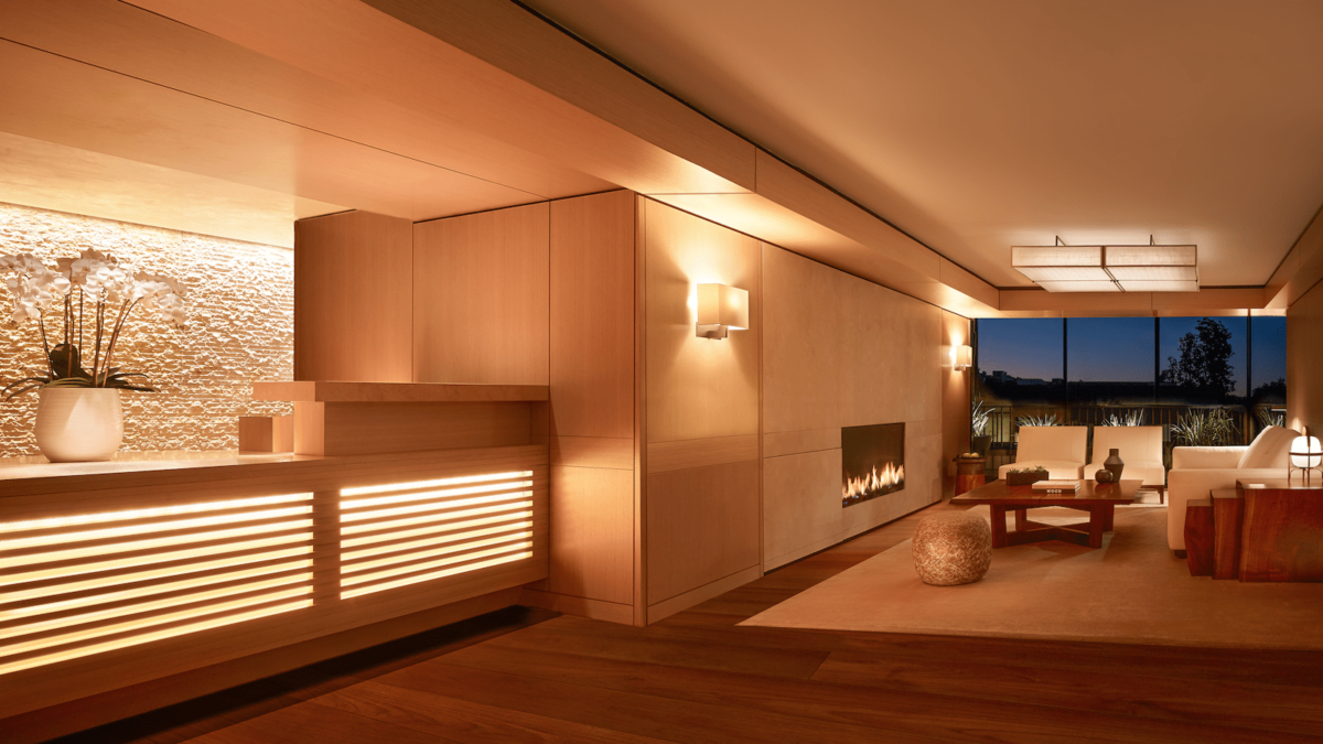 A sleek, modern hotel room with fireplace in the wall at Nobu Palo Alto