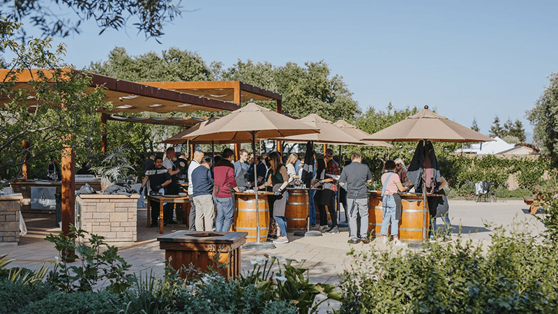 People gather at outdoor tables for Cornerstone's Music Series in Sonoma, California.