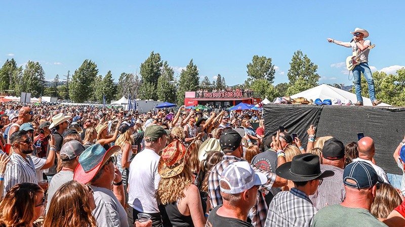 Big crowd and singing cowboy at Country Summer Music Festival in Sonoma.