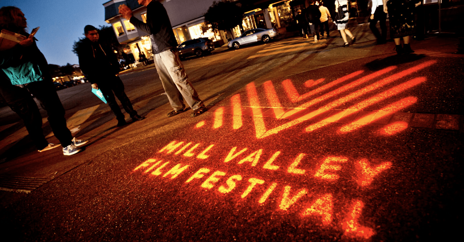 Logo of Mill Valley FIlm Festival projected onto sidewalk
