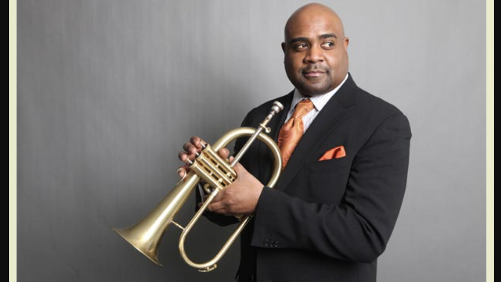 Trumpeter holds trumpet at Stanford Jazz Festival, coming in July