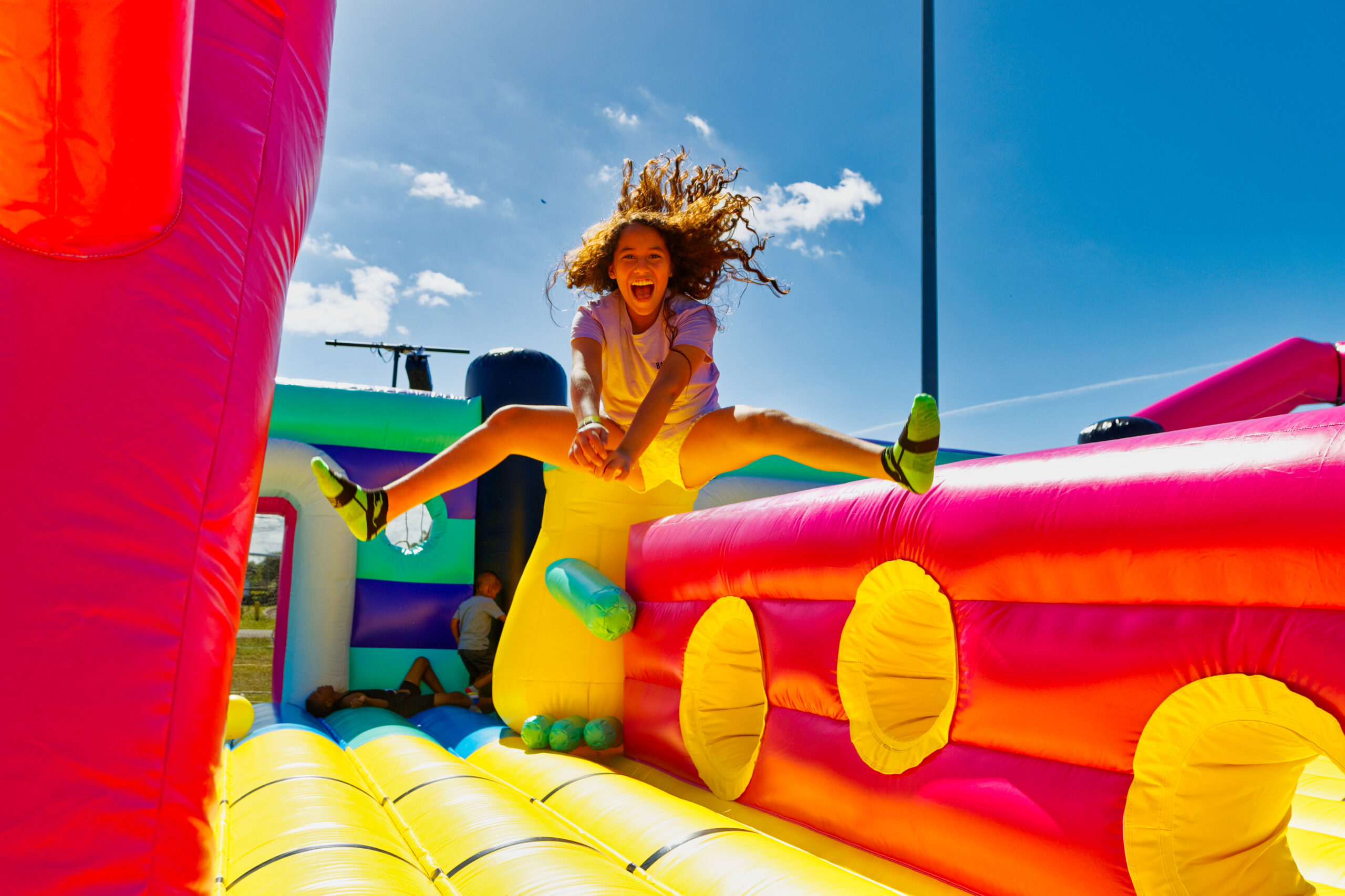 Kid jumps on bounce house for Big bounce american in the north bay