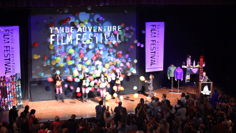 Balloons fall on stage of Tahoe Adventure Film Festival.