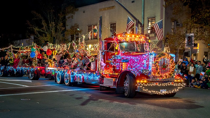 Tow truck covered in Christmas lights for Napa's Tractor Parade.