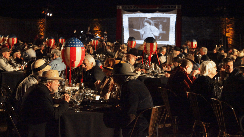 Guests sit at tables for Wine Country's Jack London Historic Park's annual fundraiser gala in Glen Ellen, California