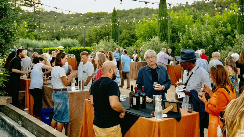 People sample wines at outdoor estate for Access Alexander Valley in Geyserville, California.