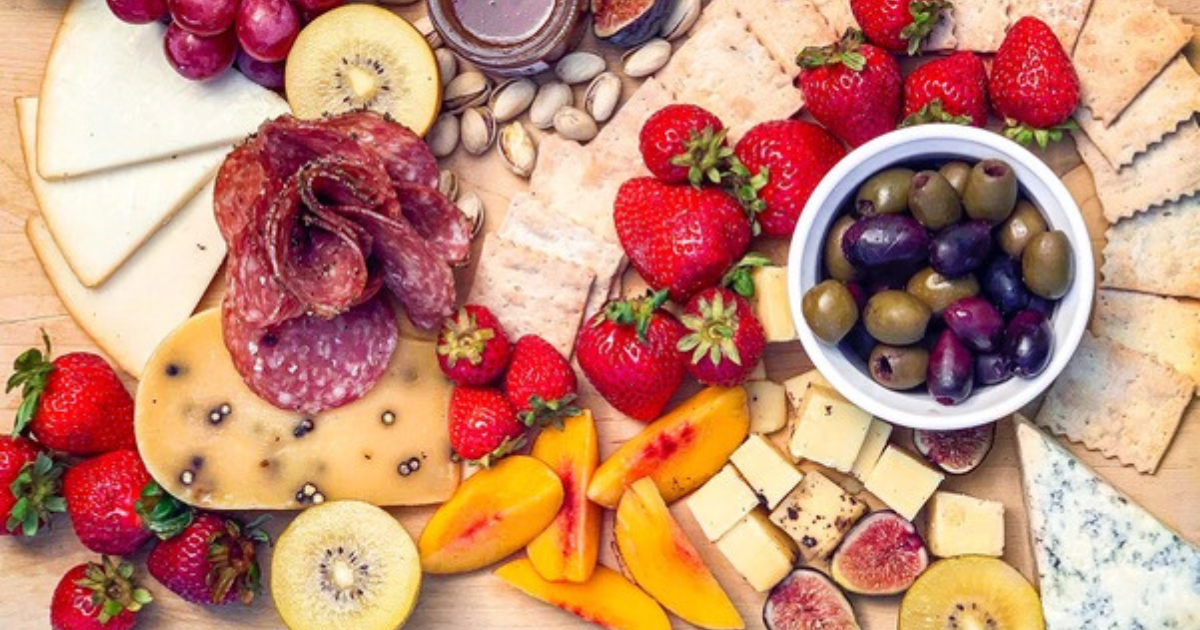 A charcuterie board of olives, cheese and deli meats at San Francisco Cheese Festival.