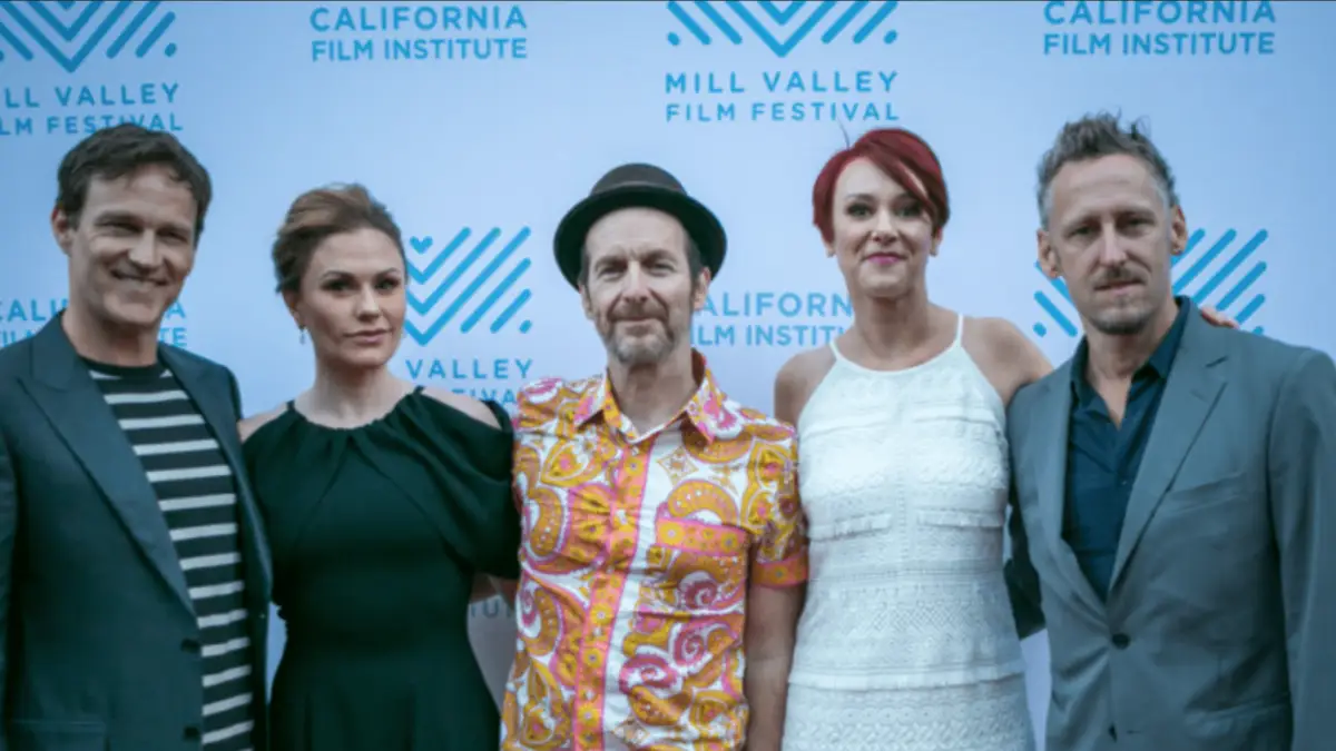 A group of five people, three men and two women, stand together on a red carpet at the Mill Valley Film Festival, one of the Best Annual Events in the North Bay. They are dressed in a mix of formal and casual attire, with a branded backdrop behind them featuring the California Film Institute and Mill Valley Film Festival logos.