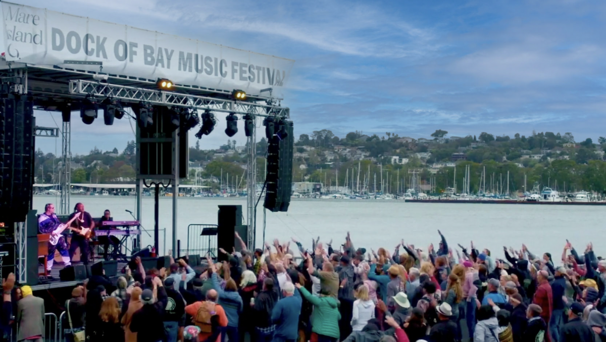 A crowd cheers a musical act at Dock of the Bay Festival in the East Bay this September