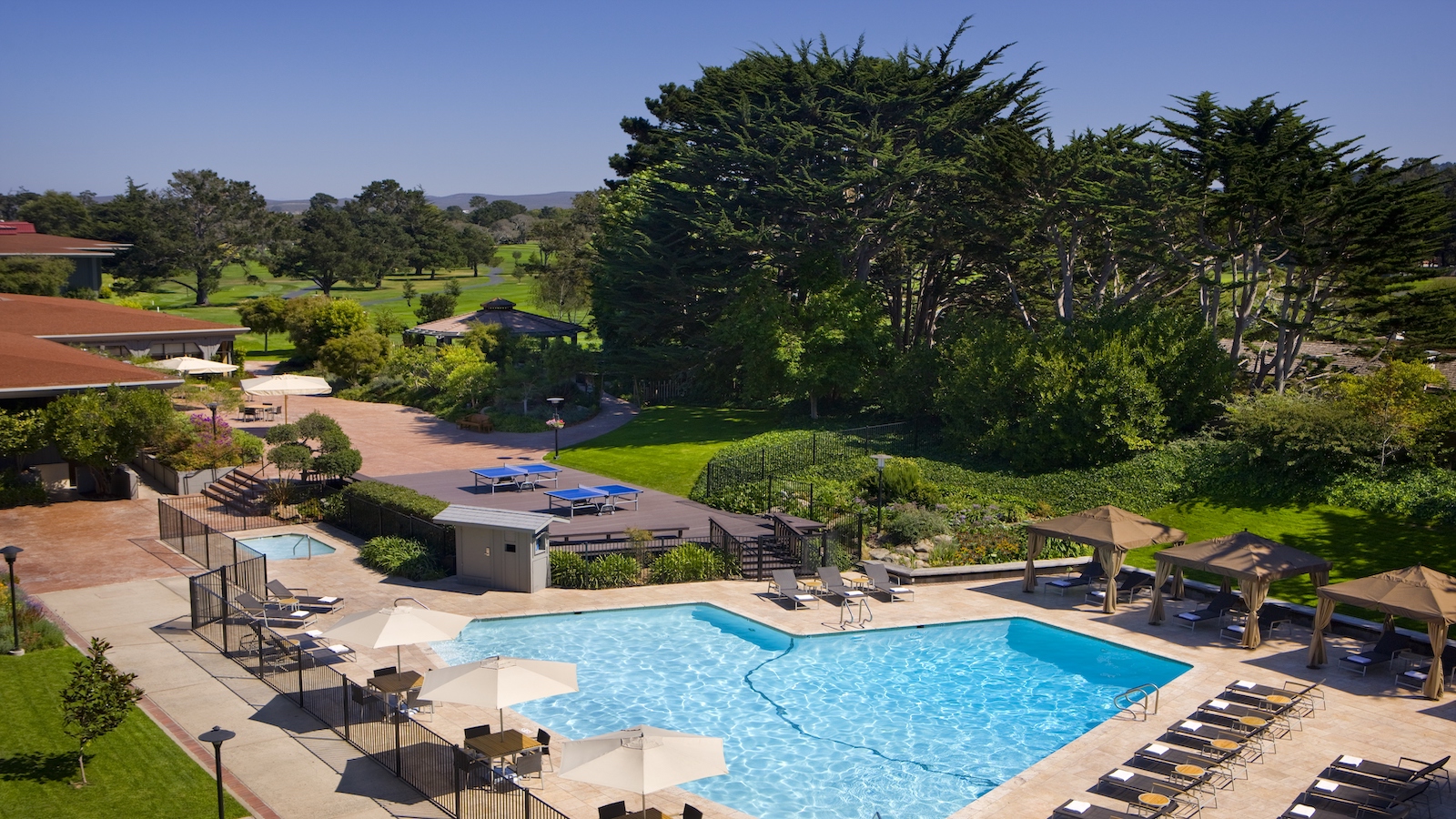 Outdoor pool and chairs at Hyatt Regency Monterey in Monterey, California.