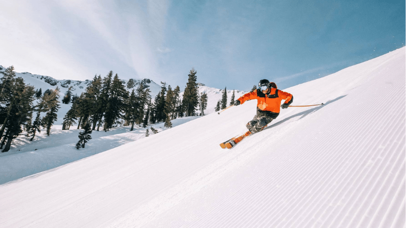 Skier riding down slope in Tahoe Palisades.