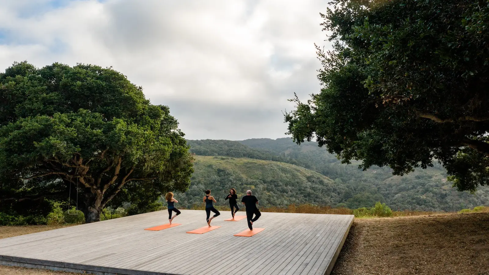 People do yoga in the hills above Carmel Valley Ranch in Carmel, California
