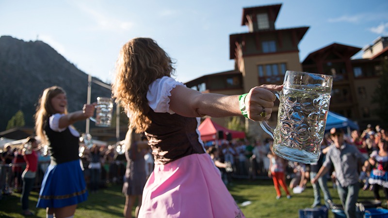 Women in costume hold beer mugs at Tahoe's Oktoberfest