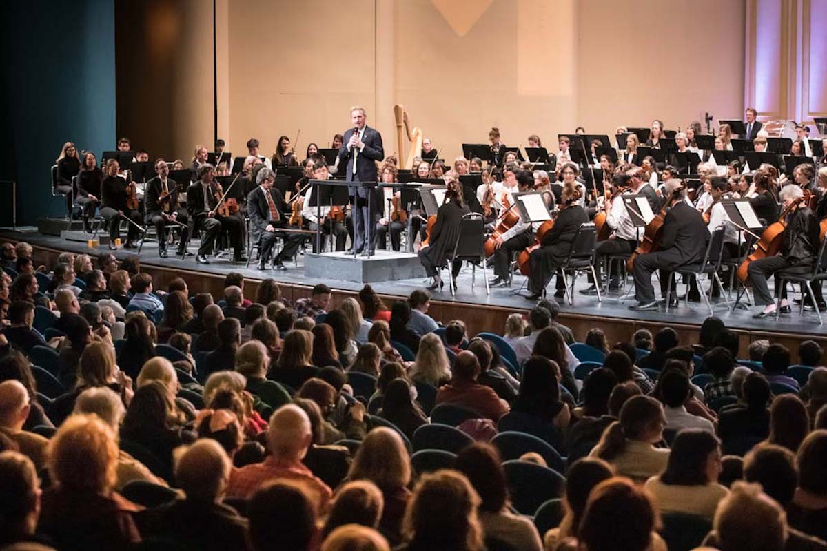 Marin symphony sits on stage with audience watching