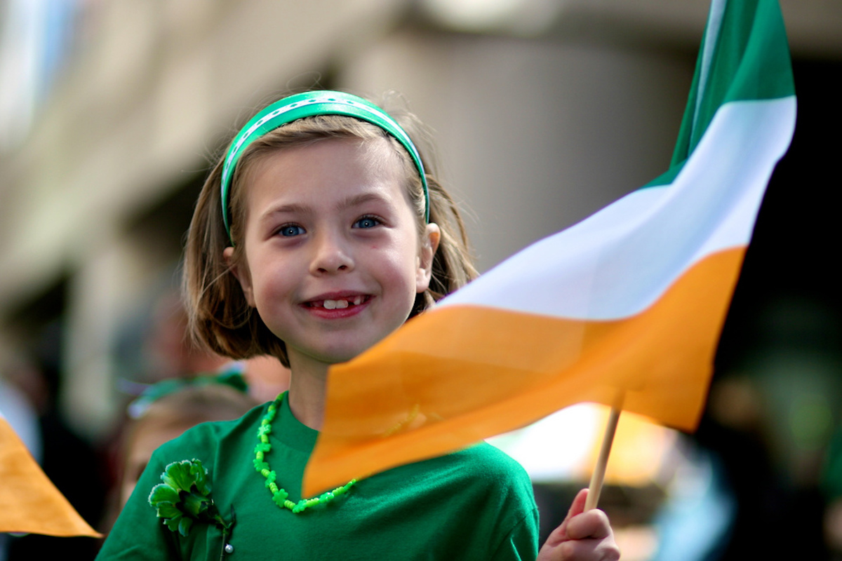 Little girl waving Irish flag at St. Patrick's Day San Francisco