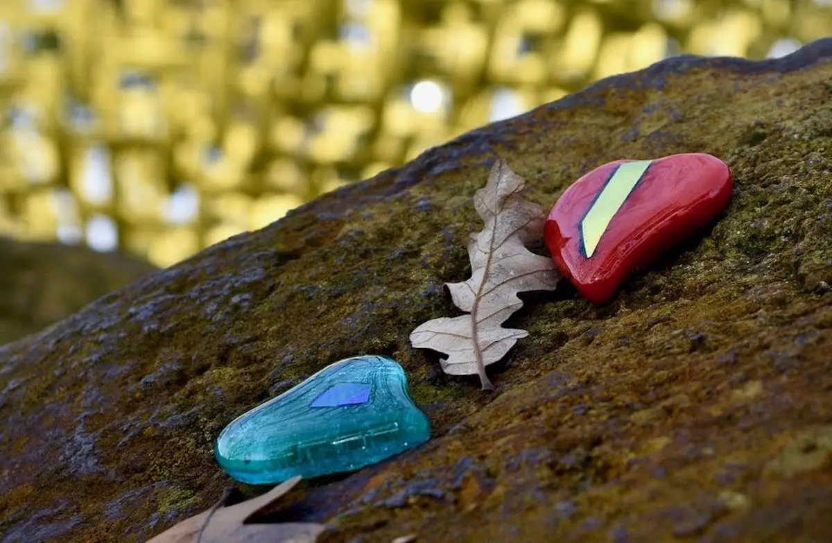 Painted stones and leaf on branch for Yountville Arts Sphere Hearts Napa Valley