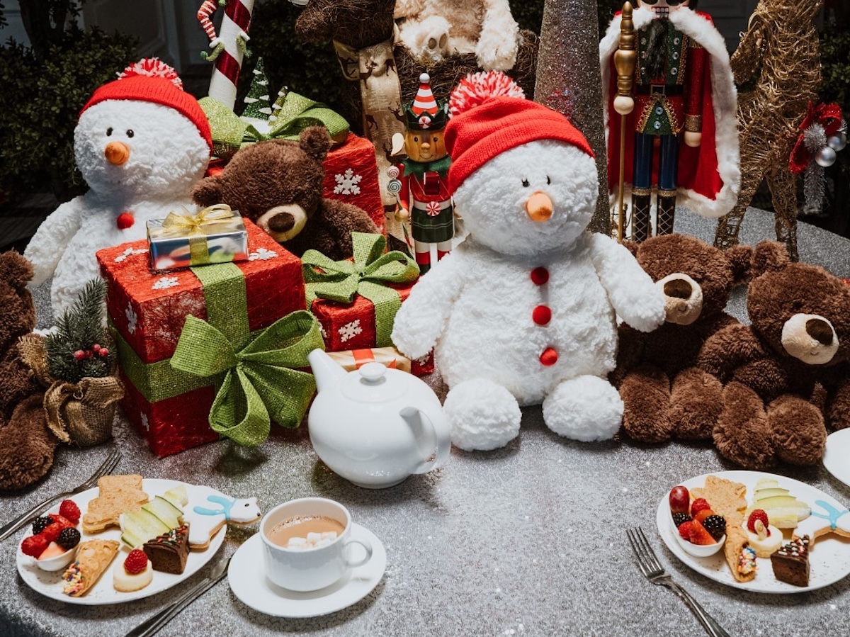 Table setting with teddy bears, snowmen and teacups at Ritz-Carlton San Francisco for Teddy Bear Tea