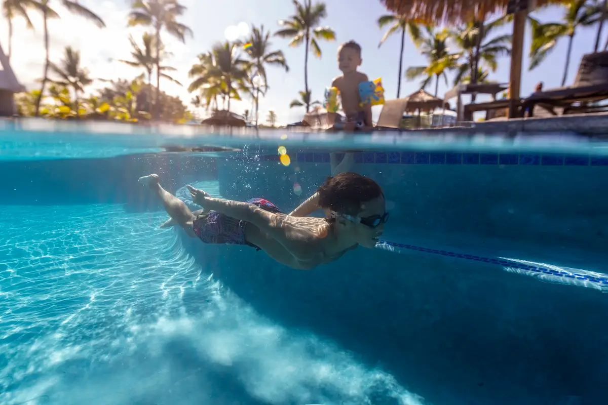 Kid swimming in the Outrigger Kona Resort and Spa Pool