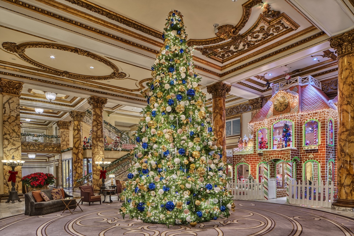 Lobby of Fairmont Hotel San Francisco with tall Christmas tree and gingerbread house