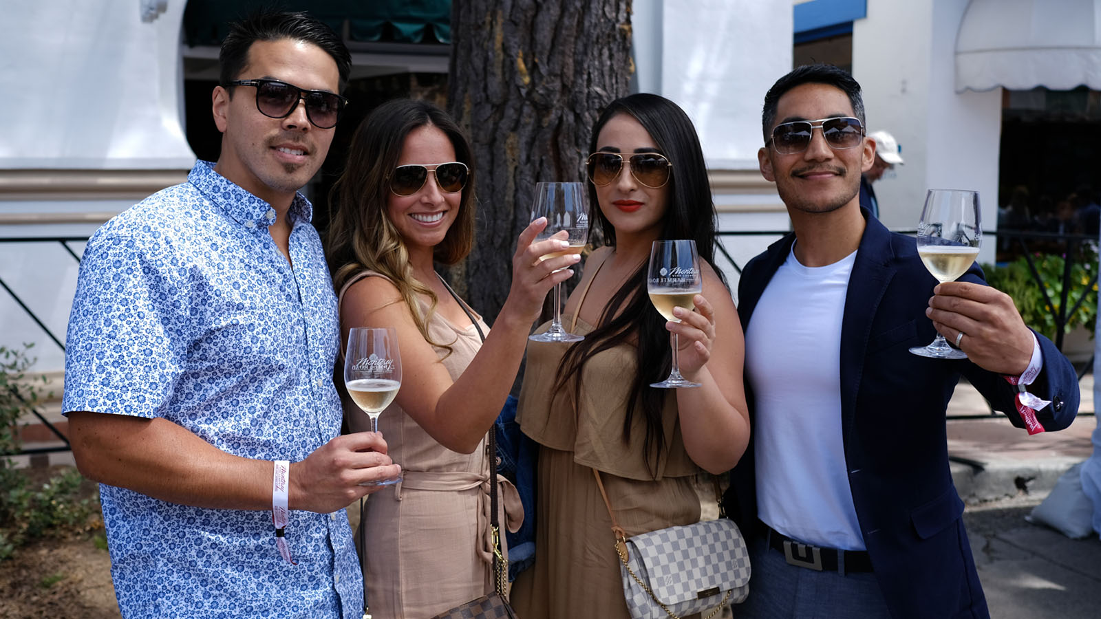 Group of friends toast wine at Santa Cruz Wine Walk in May
