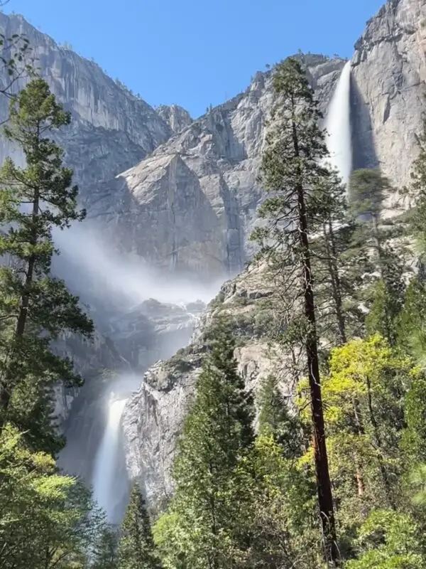 Large waterfall spilling into the Yosemite Valley, California for waterfall hike