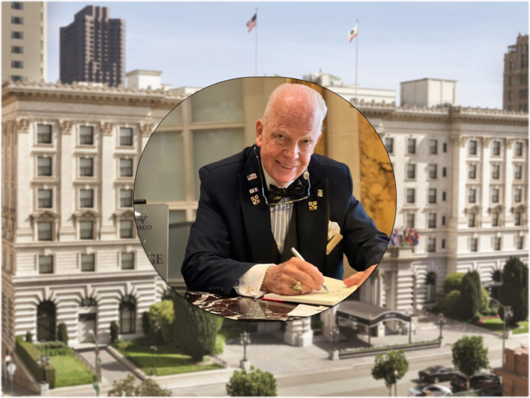 A distinguished man in formal attire and a bow tie is signing a document at a desk. His image, reminiscent of Tom Wolfe's style, is set within a circular frame, superimposed on the facade of a historic, ornate building with flags and trees in the foreground. It's like Fall in San Francisco captured in an image.