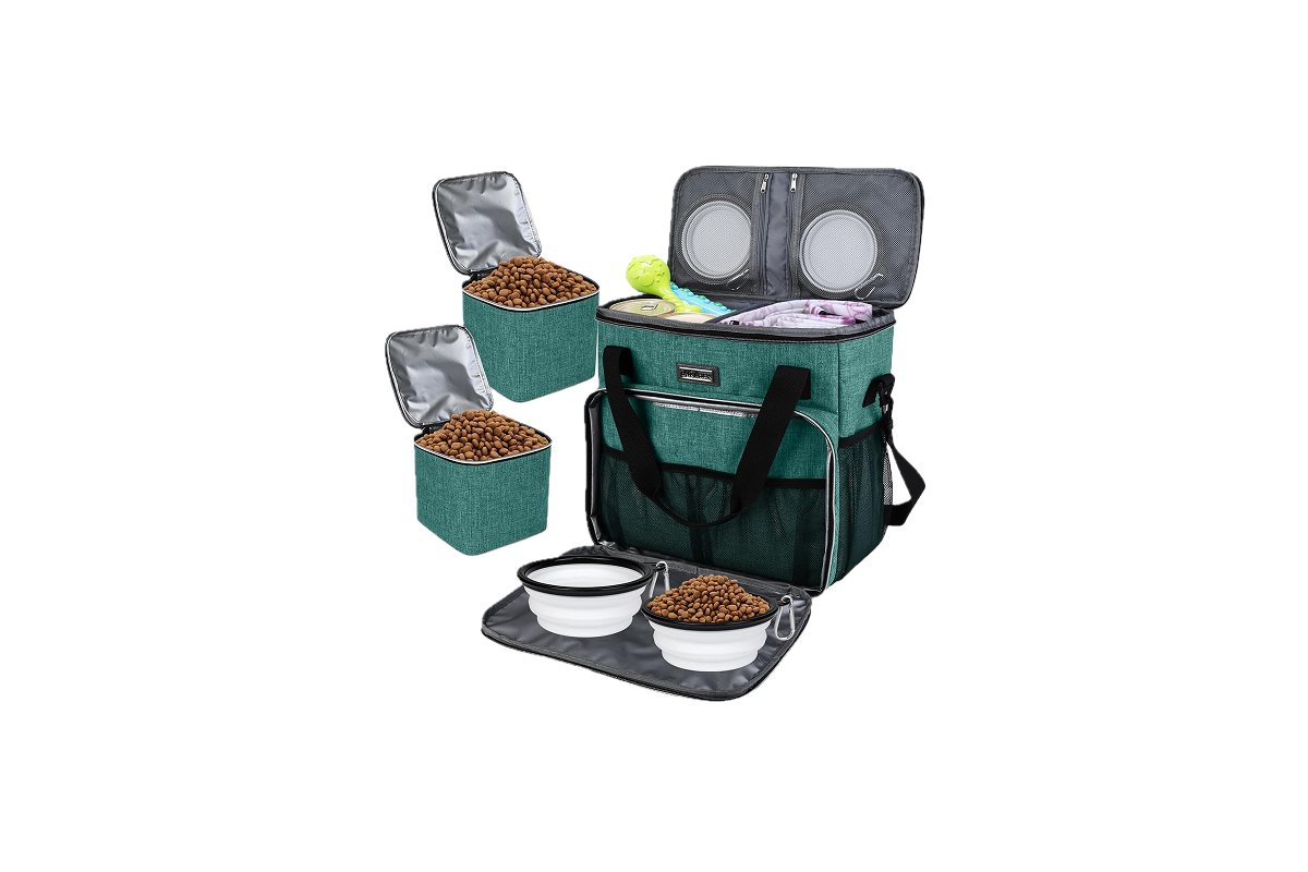 A green and black bag with containers of dog food, and water bowls.