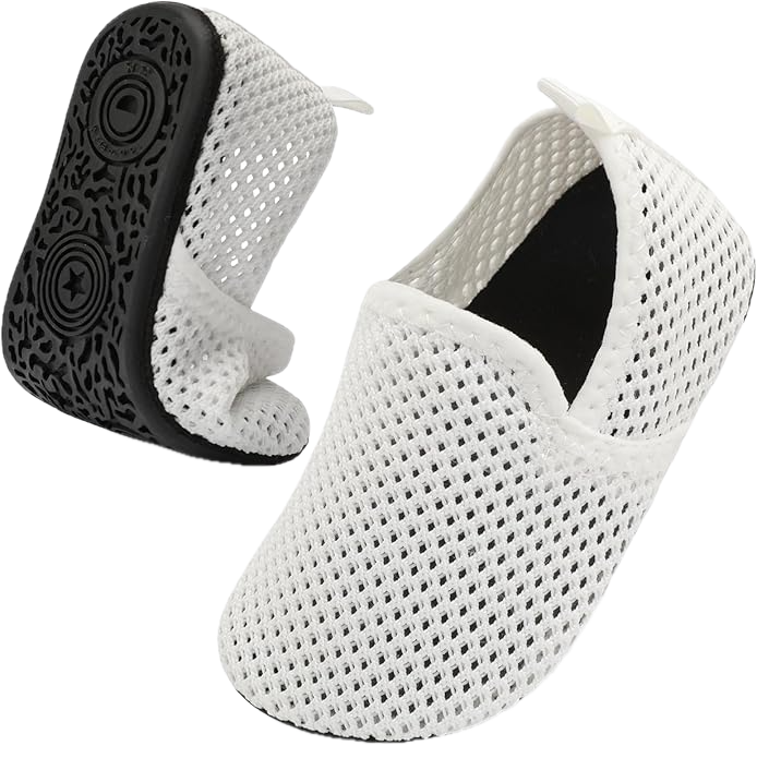 A pair of white, mesh, slip on shoes.