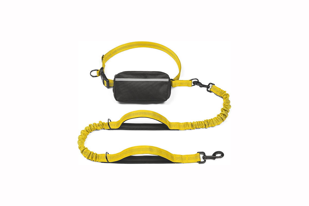 A yellow dog leash attached to a black fanny pack.