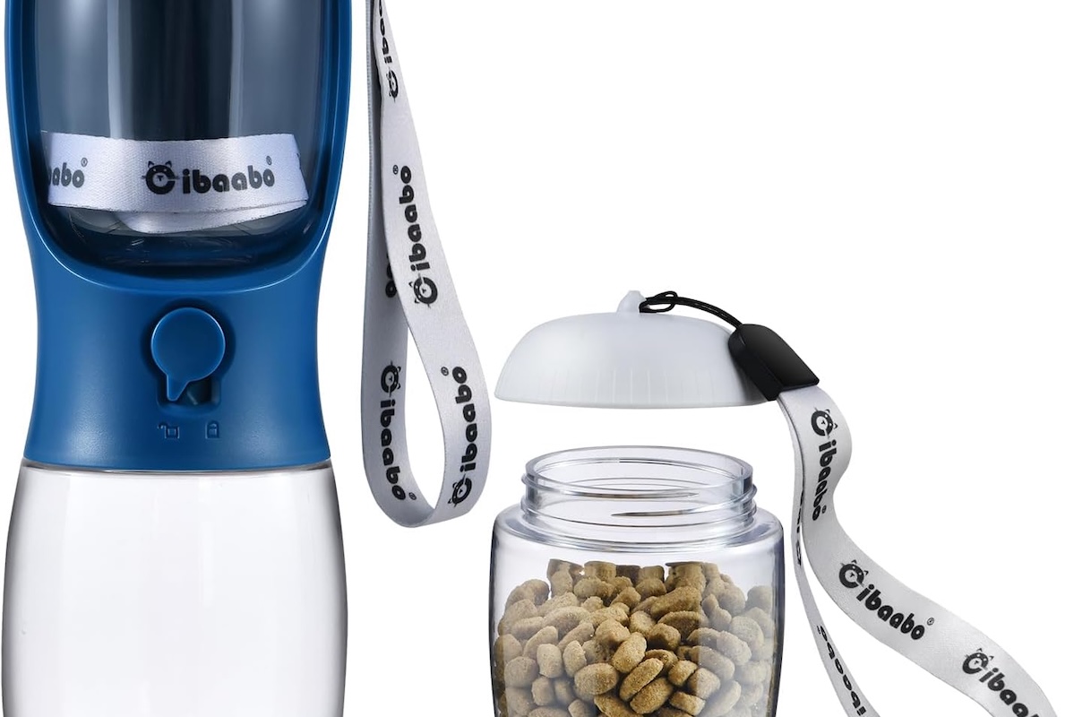 A dark blue water bottle dispenser with a plastic compartment on the side filled with dog kibble.